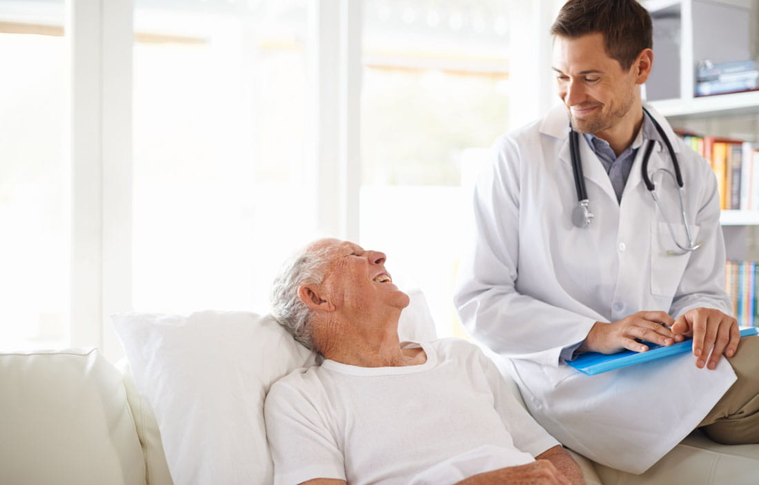 Elderly male senior citizen talking with a doctor. 